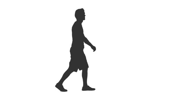 Silhouette of Man Tourist Walking in Shorts and T-shirt