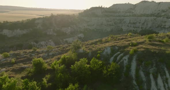 aerial footage of people running on a small trail of a quarry, fetesti, moldova