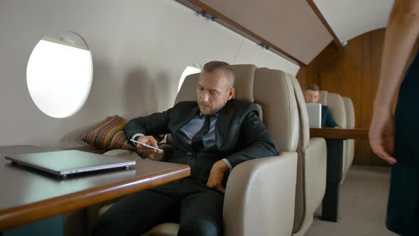 Businessman Travel on Private Jet and Chat.