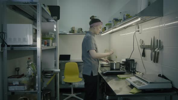 Chef Preparing Food In A Commercial Kitchen