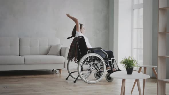 Woman dancing on wheelchair