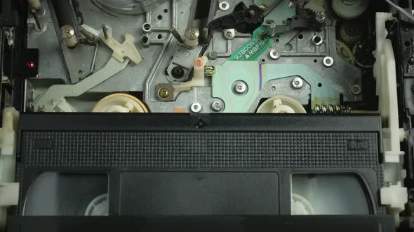 The Process of Loading a Video Tape Into a VCR