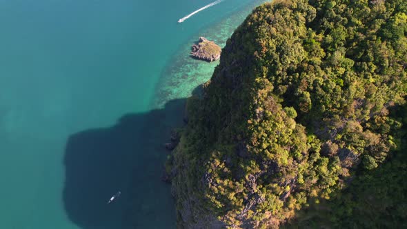 aerial top down view of limestone mountains at Ko Poda Island surrounded by turquoise blue ocean as