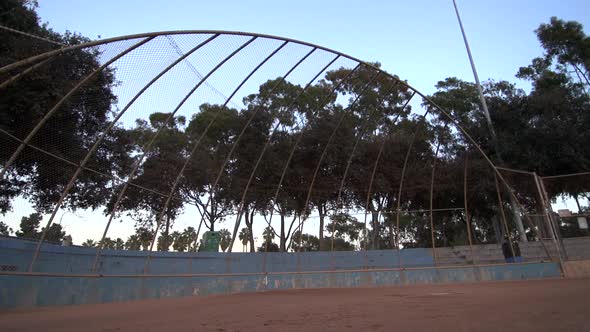 A baseball player practicing his swing.