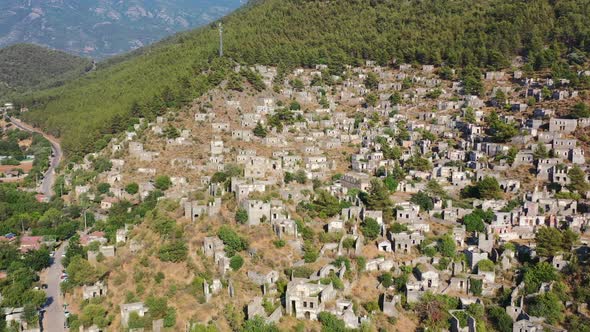 wide aerial drone opening sequence of the famous abandoned ghost village of Kayakoy located in Fethi