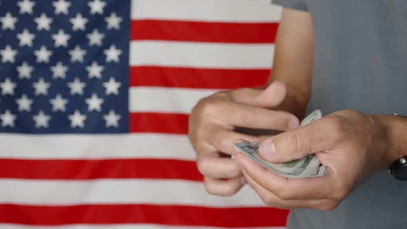 Counting Money Against American Flag