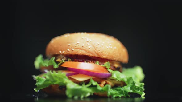 Big and Tasty Burger is Rotating on the Plate