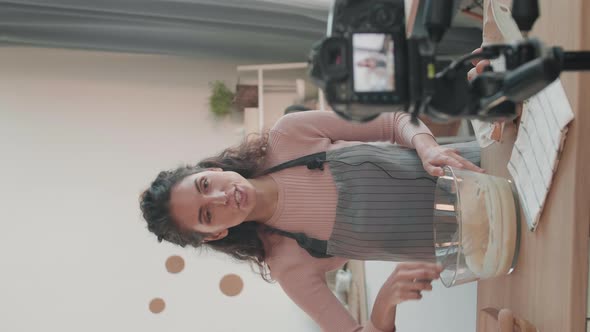 Woman Mixing Dough for Video Tutorial