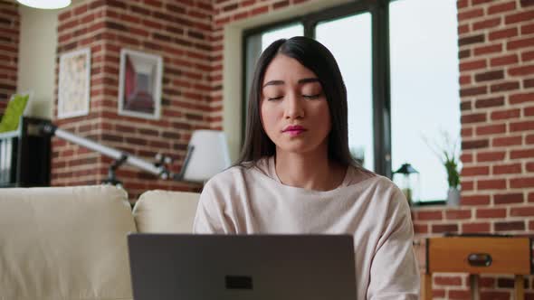 Focused Freelancer Woman Working Remotely From Home on Modern Laptop