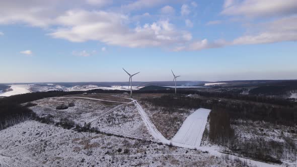 Aerial Drone View Wind Power Turbine on the Horizon Green Energy Concept