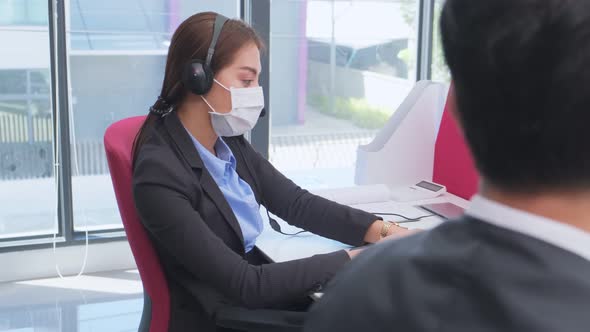 Group of Asian team business people man and woman wear face mask, working in office with new normal