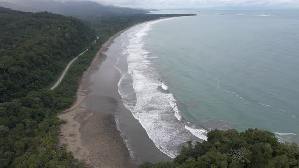 Wide aerial view of a tropical beach as a storm approaches, Costa Rica