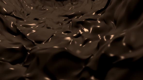 Flowing Stream of Melted Liquid Chocolate