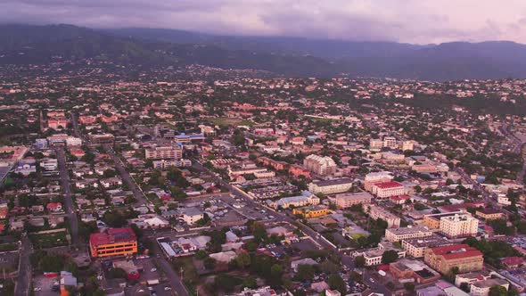An aerial overview of Kingston, Jamaica. Taken during sunset from above the Pagasus Hotel. Panning f