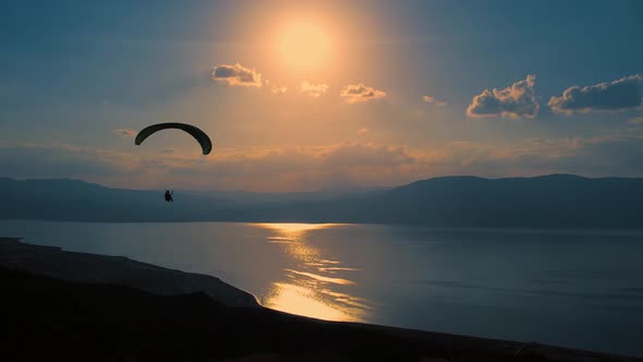 Sunset Landscape and a Person Flying