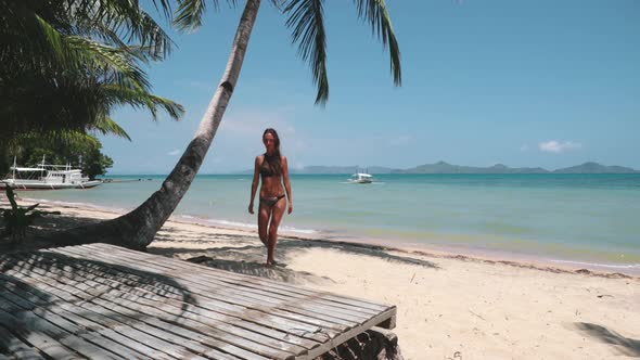 Sexy Girl in Bikini Walk Sibaltan Tropical Beach