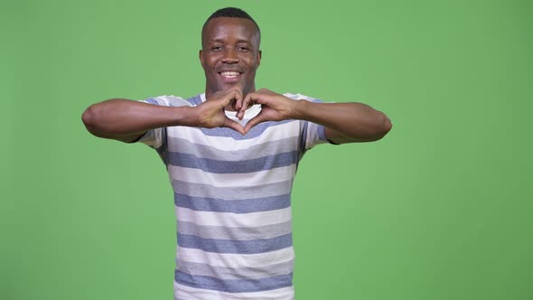 Young Happy African Man Doing Hand Heart Gesture