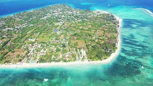 Maldives, tropical atoll island surrounded by the fringing coral reef with preserved nature and luxu