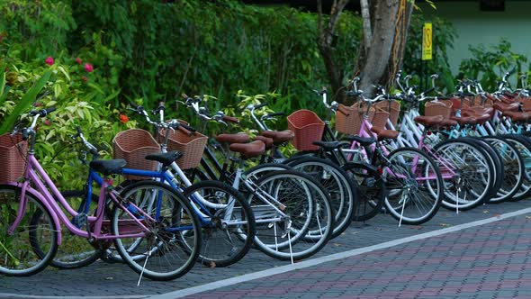 Slow Motion Of Bicycle Parked Against Wall Outside Hotel  South Male Atoll Maldives