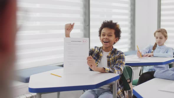 African School Boy Is Excited with Test Result