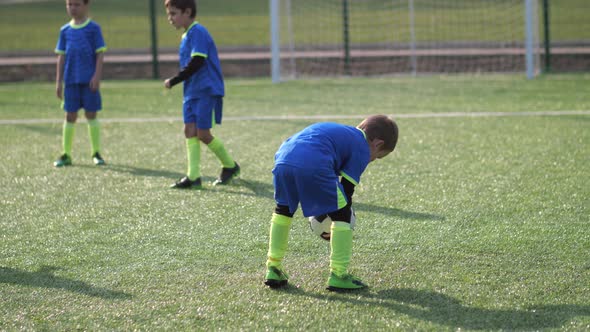Stubborn Soccer Player Training To Kick Ball