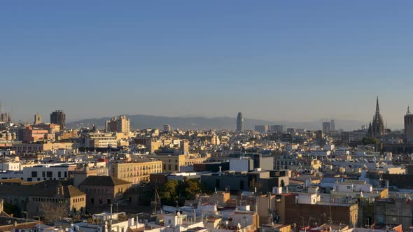 Panning shot of the Barcelona skyline on a sunny winter morning.