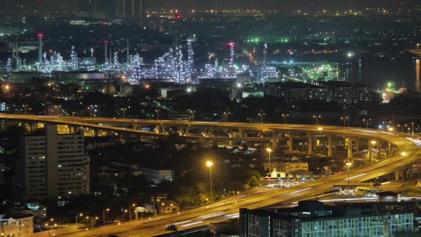 view of Bangkok city, Thailand, showing traffic on motor way, oil refinery and shipping port