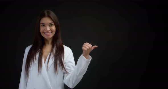 Woman Pointing to an Empty Space for your Advertising Content