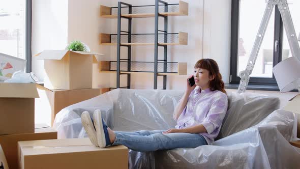 Happy Woman Calling on Phone Moving to New Home