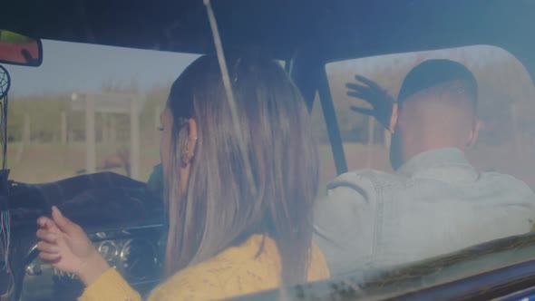 Young couple on a road trip in their pick-up truck