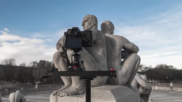 Camera On A Slider Taking Shot Of A Sculpture On The Stair To The Monolith. Gustav Vigeland's Artwor