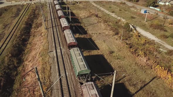 Freight Train is Passing a Highway