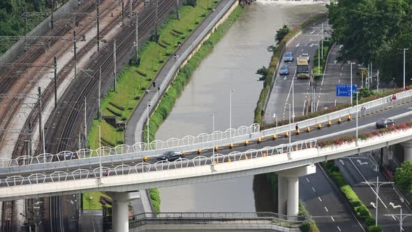 Aerial view of Shenzhen metro train move fast on the track with overpass transportation