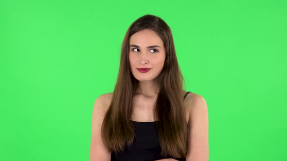 Young Girl Thinks About Something, and Then an Idea Comes To Her. Green Screen