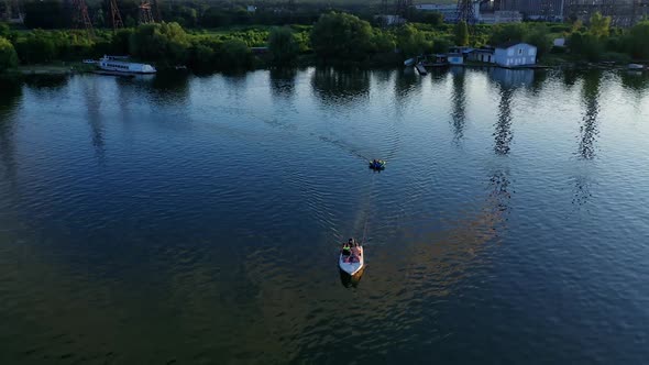 Motor boat on the river. Aerial view of speed boat sailing on river