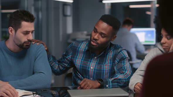 Diverse Stressed Business Team Having Meeting Late in Office