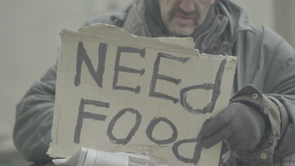 The Inscription "Need Food" By a Poor Homeless Tramp. Kyiv. Ukraine