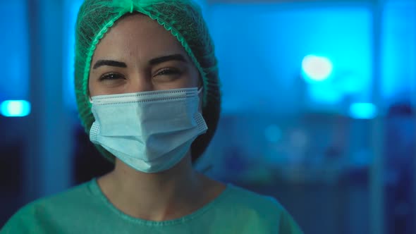 Young female doctor wearing protective face mask during corona virus pandemic