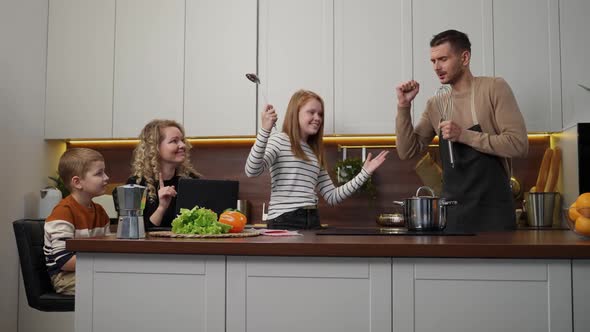 Positive Deafmute Family Having Fun in Kitchen