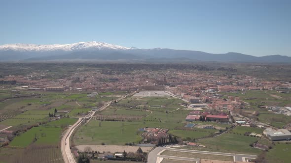 Aerial shot of Guadix and snowy mountains alt