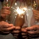 group of four people enjoying new year night celebrating with sparklers in the middle - VideoHive Item for Sale