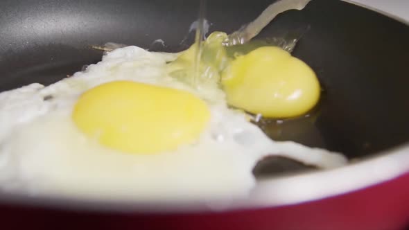Close Up View of the Fried Egg on a Frying Pan Slow Motion
