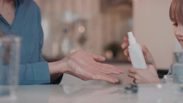 Rubbing Hands After Sanitizer Spraying