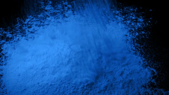Blue Powder Is Poured Into Pile