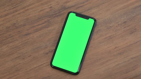 Using Smartphone on Table Chroma Screen