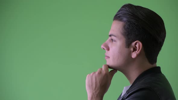 Closeup Profile View of Happy Young Handsome Multi Ethnic Man Thinking