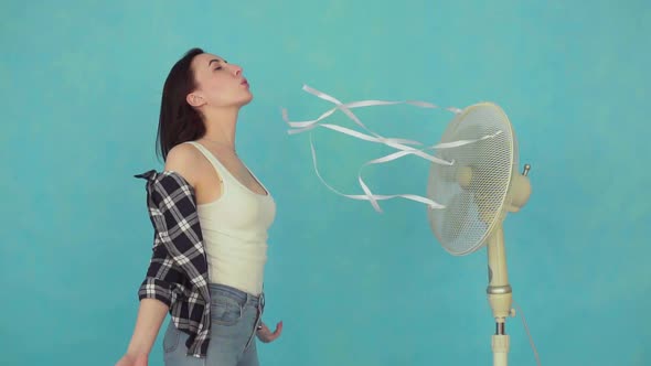 Young Woman with Electric Fan Enjoying Cool Wind Slow Mo