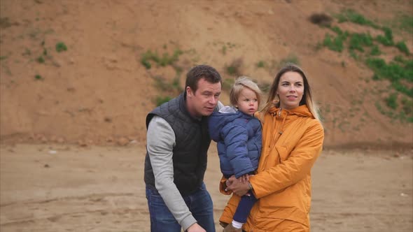 Outdoor Leisure of Young Family with Little Daughter