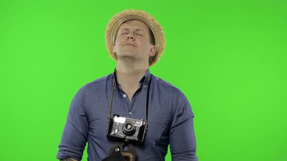 Portrait of Man Tourist Photographer Relaxing on Vacation. Chroma Key