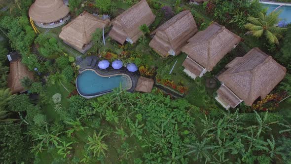 Aerial view of a small resort in the middle of a forest, Bali island, Indonesia.